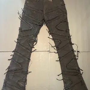 Men's Black Stack Jeans with Distressed Fringe and Studs for Edgy Style