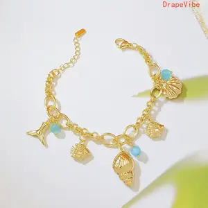 18K Gold Plated Ocean Inspired Bracelet with Shell Conch Mermaid Tail and Blue Cat Eye Stone Minimalist Stylish Design for Daily Wear
