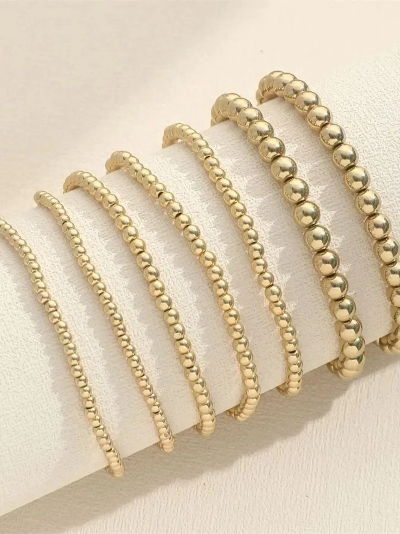 Seven-piece Gold Bead Elastic Bracelet Set, Beaded Bracelets, Beaded Bracelet Sets, Light Luxury Style, Round Shiny Gold Beads, High-elastic String, For Single or Layered Wear, Suitable for Commute & Shopping, Stackable Bracelets