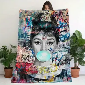 A flannel blanket with Audrey Hepburn graffiti print, soft and suitable for all seasons, perfect for sofa, bed, office, travel or camping 50*40