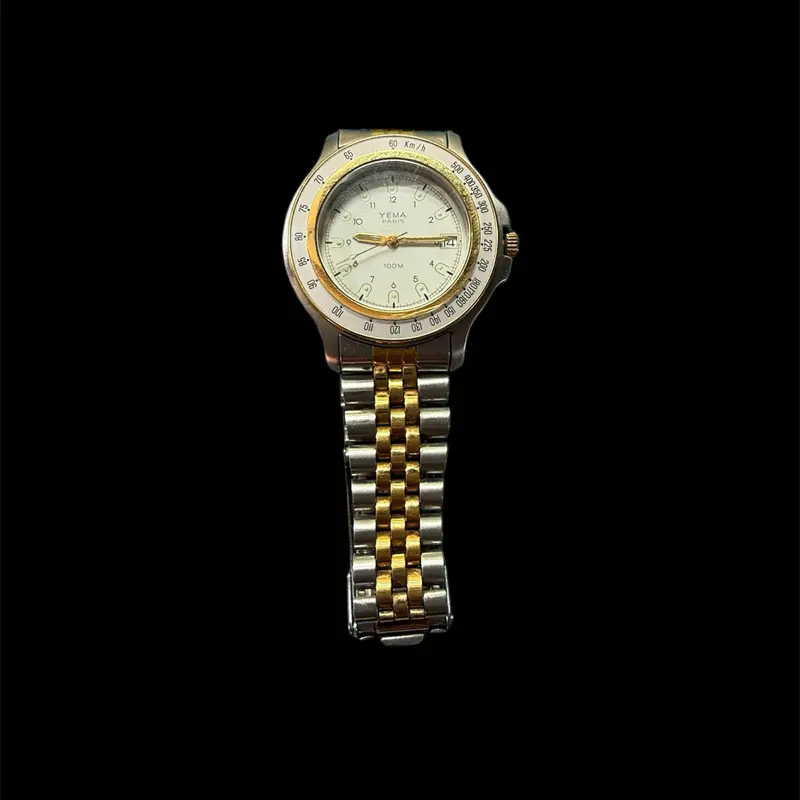 This is a Yema Paris 100M wristwatch with a two-tone band. Dial Quartz Watch