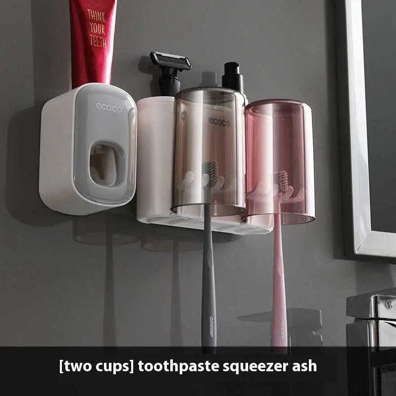 Two cup toothbrush holders gray white toothpaste