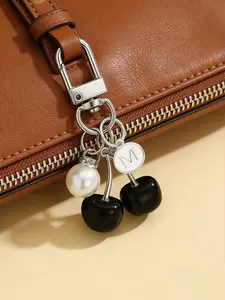 Fashionable high-quality cute cherry black butterfly bag charm - cherry key fashion backpack accessory, keychain, bag charm with silver letter pendant, earphone charm, car decoration, decorative hanging accessory, cherry keychain, Fashion Bag Charms