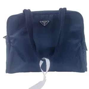 Pre-owned PRADA leather handbag navy blue nylon top handle bag with signature silver triangle logo. qg532