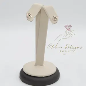 10k earrings WITH CIRCLE DESIGN AND STONE IN THE CENTER STUCK WITH SCREW BACK