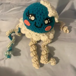 Handcrafted Crochet Amigurumi Plush Toy - Adorable Teal-and-Cream Character, Unique Design for DIY Knitting Enthusiasts