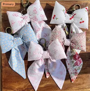 Hand sewed puff bow keychains for any purse or bag!