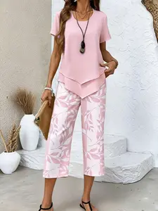 Casual two-piece set: short-sleeve top with an asymmetrical hem + plant-print capri pants, comfortable women’s outfit for home and going out