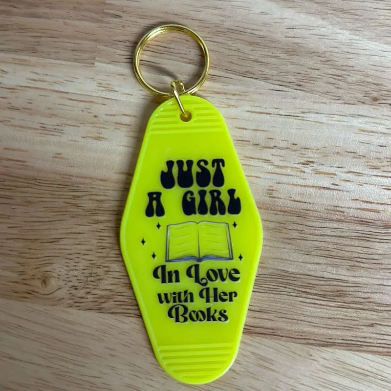 Just a girl in love with her books retro motel keychain