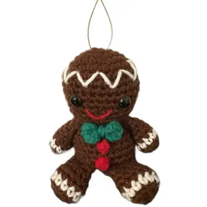 Snappy the Gingerbread Man Ornament - Brown Handmade Crocheted Gingerbread Man Ornament with Red Buttons, a Green Bow Tie, and White Frosting Accents