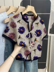 Women's khaki bohemian vacation short-sleeve knit top. Loose round neck, contrast purple floral print, front tie and contrast piping. Comfortable for spring & summer casual wear.