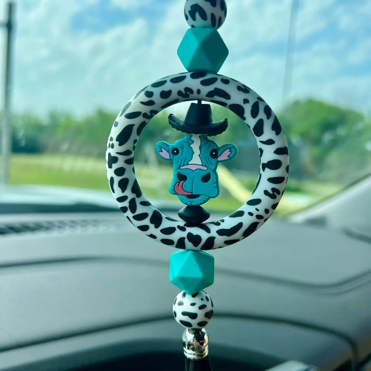 Blue cow with cowboy hat car charm