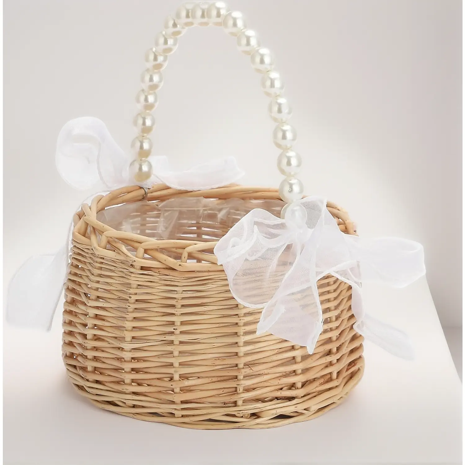 1 piece wicker rattan flower girl basket with 1 piece wedding wrist corsage. Handwoven wicker basket with pearl handle and bow. Fairy flower basket rattan basket for weddings bridal anniversary party decor.