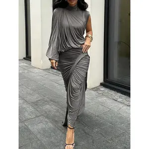 Women’s two-piece set featuring a solid-color slim-fit long skirt: French semi-high-neck one-shoulder long-sleeve top + slim-fit pleated skirt. Elegant yet casual women’s wear for spring and summer; autumn set GARMENTARY