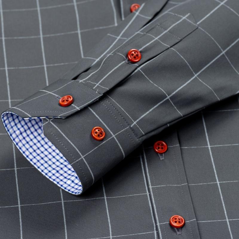 Men’s long-sleeve shirt with four plaid color-block panels, business-casual style. Button-down notched collar design for a sharp look, red buttons add refined details, blue-and-white plaid interior provides visual depth. Long-sleeve fit suitable for multi