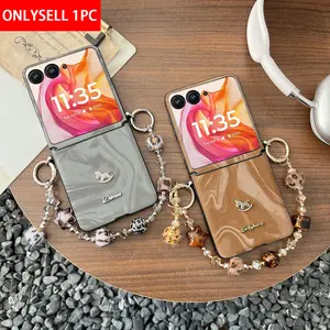 PU leather water ripple pattern with rhinestone carousel protective smartphone case, comes with a bracelet. The hard PC back plate protects the phone. Compatible with Motorola Razr 2024, Razr 2025, Razr 50, Razr 60, Razr 50 Ultra, Razr 60 Ultra