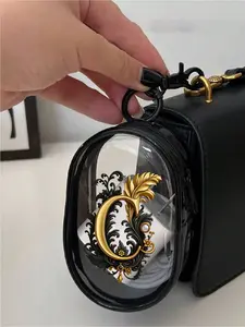 Golden floral A-Z letter transparent zipper pouch with keychain. Compact multi-purpose bag for earphones, chargers, cables and small accessories. Exquisite travel organizer, ideal birthday, graduation and holiday gifts.
