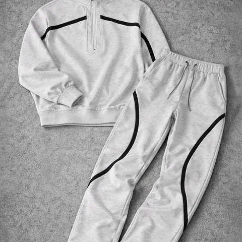Men’s half-zip couple set featuring a printed zip-up top with matching leggings; loose, casual street style; coordinated outfit; complete athletic tracksuit set.