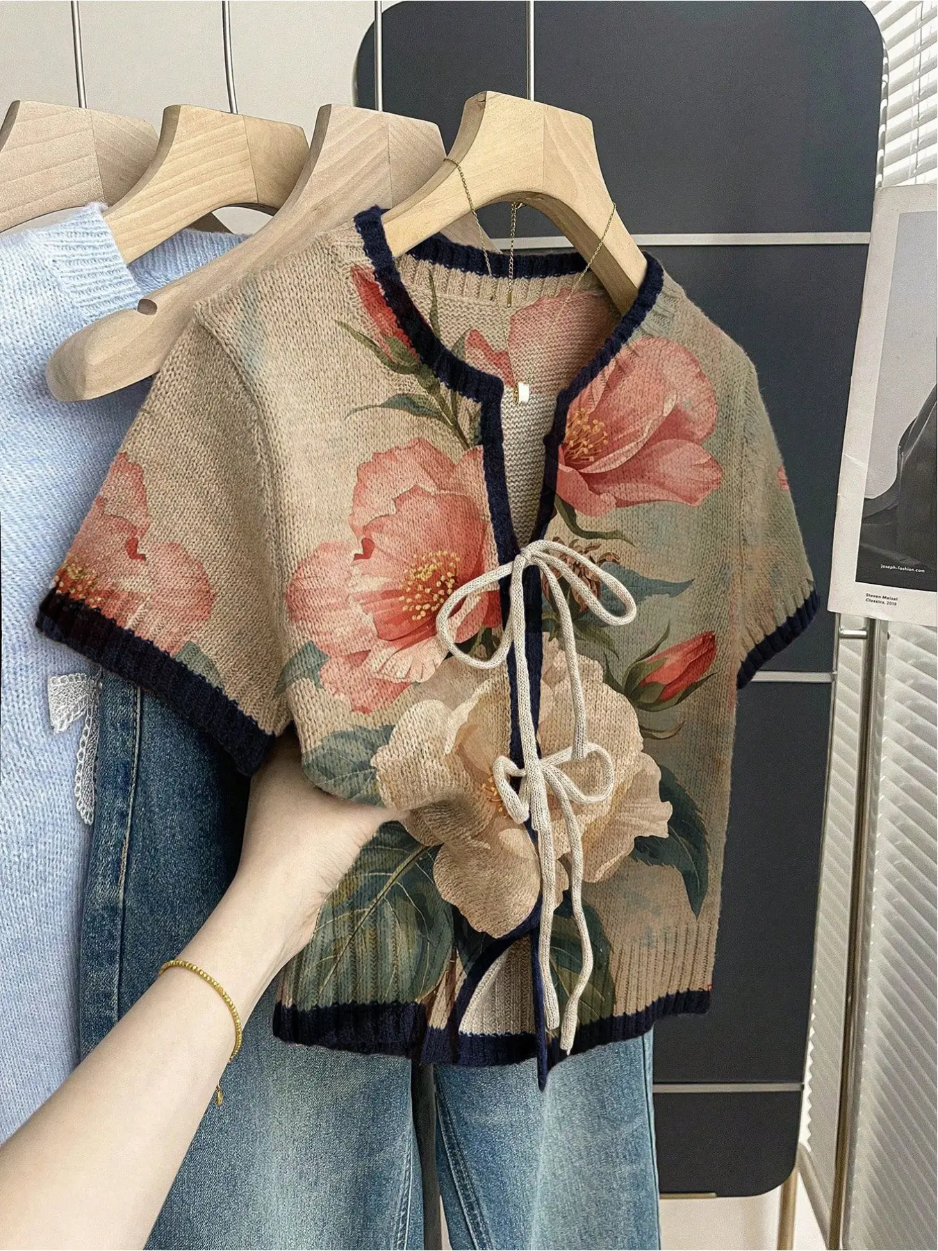 Women's khaki bohemian vacation short-sleeve knit top. Loose round neck, contrast large floral print, front tie and contrast piping. Comfortable for spring & summer casual wear. Boho Chic Floral Womenswear