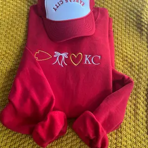 KC Line Sweatshirt - Red Sweatshirt with Heart and Arrow Design Featuring "Kansas City"