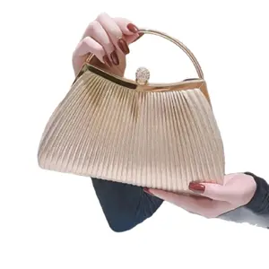 Gold Clutch Bag - Elegant Design with Decorative Detail and Adjustable Strap