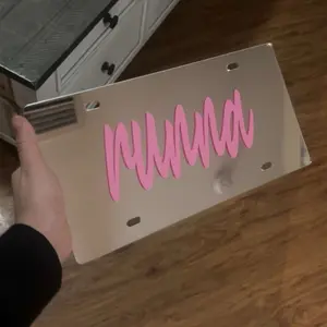 RUNNA Front Chrome License Plate with Pink RUNNA Design for Custom Vehicle Identification