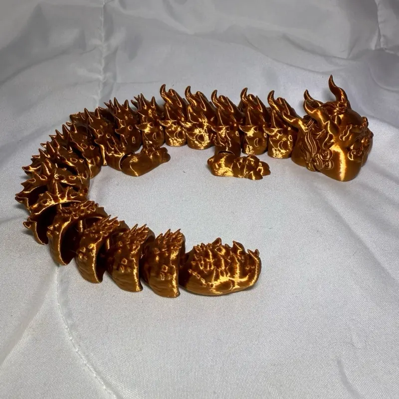 3d printed articulated fat dragon in silk copper PLA
