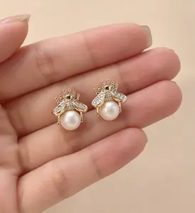Women's Gold-Tone Bumblebee Shaped Pearl Stud Earrings - Elegant Chic Costume Jewelry with Zirconia Accents, Lightweight Whimsical Accessories for Daily Commute, Rook Earrings for All Seasons, Gold Stud Earrings, Whimsical Earrings