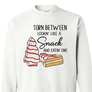 Torn Between Lookin’ Like A Snack And Eatin’ One Christmas Tree Cakes T-Shirt Crewneck Hoodie Sizes S M L XL 2XL 3XL 4XL 5XL Fast Shipping