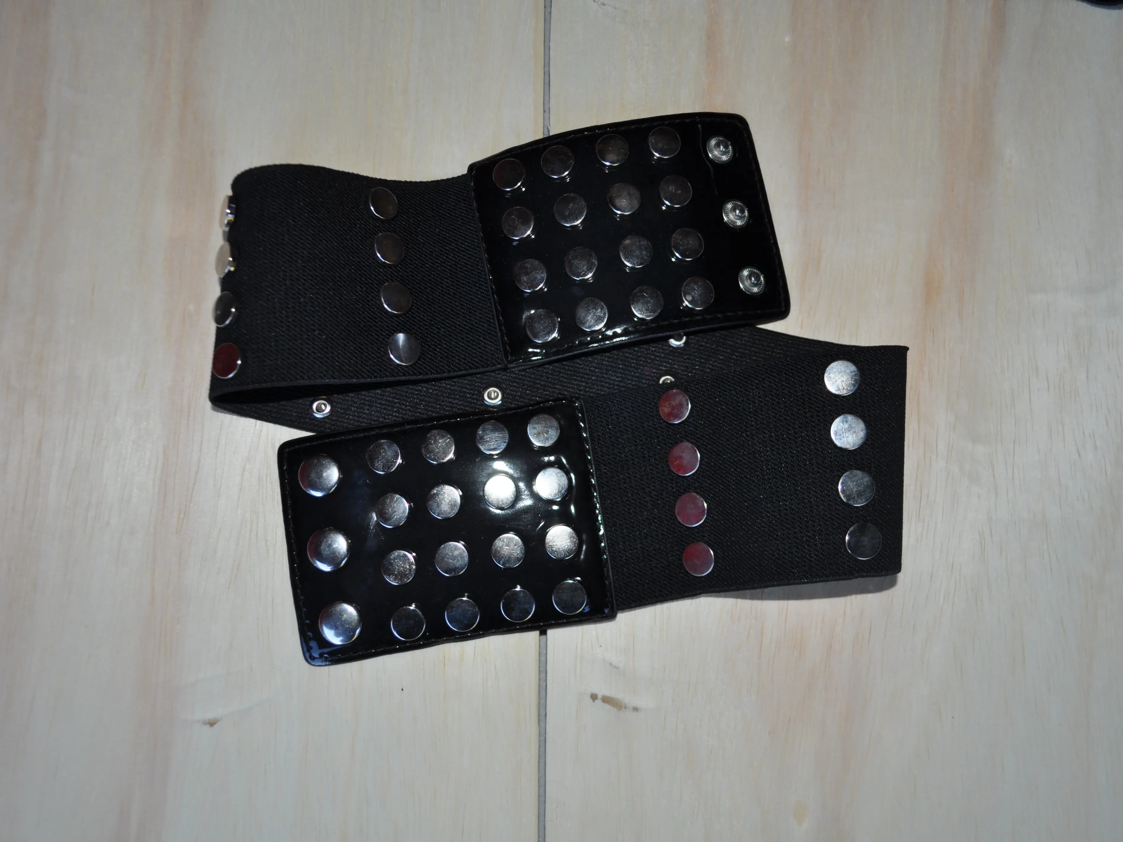 Studded Black Belt with Silver and Red Rivets for Stylish Outfits