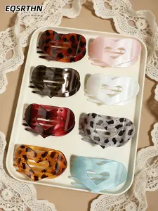 8 pieces of the EQSRTN heart-shaped hair handle, featuring a retro tortoiseshell pattern and fresh macarons, has a smooth heart-shaped design that is both fashionable and youthful. It looks great with half-tied or updo hair, and you can transform into a s