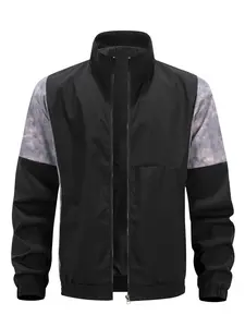 A jacket with a stand collar in a patchwork style, featuring dark textured accents on the sleeves for a visually layered and designed look. The stand collar enhances the neckline, while the zipper closure allows for easy wearing. + The cuffs are designed