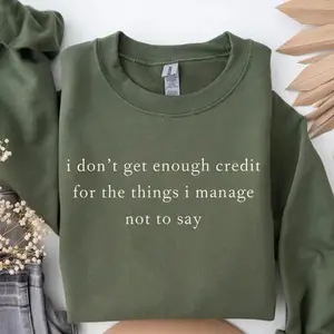Sarcastic funny crewneck sweatshirt saying I don’t get enough credit for the things I manage not to say, perfect for dry humor lovers with minimalist typography.