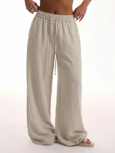 Women’s ultra-comfortable pants made from Lyocell linen weave, featuring a drawstring elastic waistband, lightweight drapey fabric, and wide legs—suitable for sports and everyday casual wear, versatile for two ways of wearing.