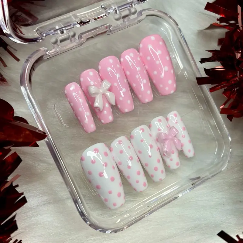 Pink and white polka dot press on nails. Application Kit Included for Stylish Manicures