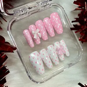 Pink and white polka dot press on nails. Application Kit Included for Stylish Manicures