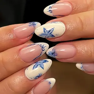 24Pcs Blue Flower Press on Nails Medium Almond French Tip Fake Nails Blue Floral Bow Designs Full Cover Reusable Artificial Nails False Nails Handmade Glue on Nails Summer Stick on Nails for Women Ceramic Floral Press-On Nails