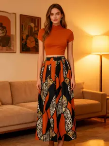 A women's set featuring an orange fitted short turtleneck top paired with a color-blocked leopard geometric print wide-leg long skirt. The style is retro and unique while also fashionable, suitable for dinner parties, art exhibitions, dates, and more.