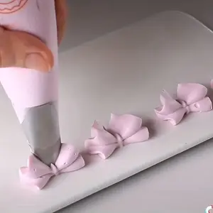 4pcs Stainless steel piping tip set - Metal piping tips Shaped for bows, leaves and lilies - Cake decorating tools for home and bakery use - Baking and pastry supplies