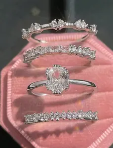 A Set Of Four Elegant Stackable Teardrop And Rectangular Rings For Women. Box Not Included.