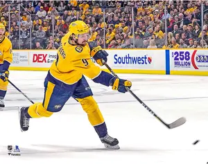 Filip Forsberg Nashville Predators Unsigned Gold Jersey Shooting Photograph