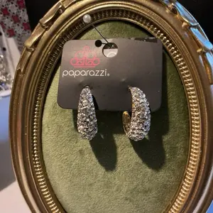 Paparazzi earrings that are full of rhinestones! Can be dressed up with ease