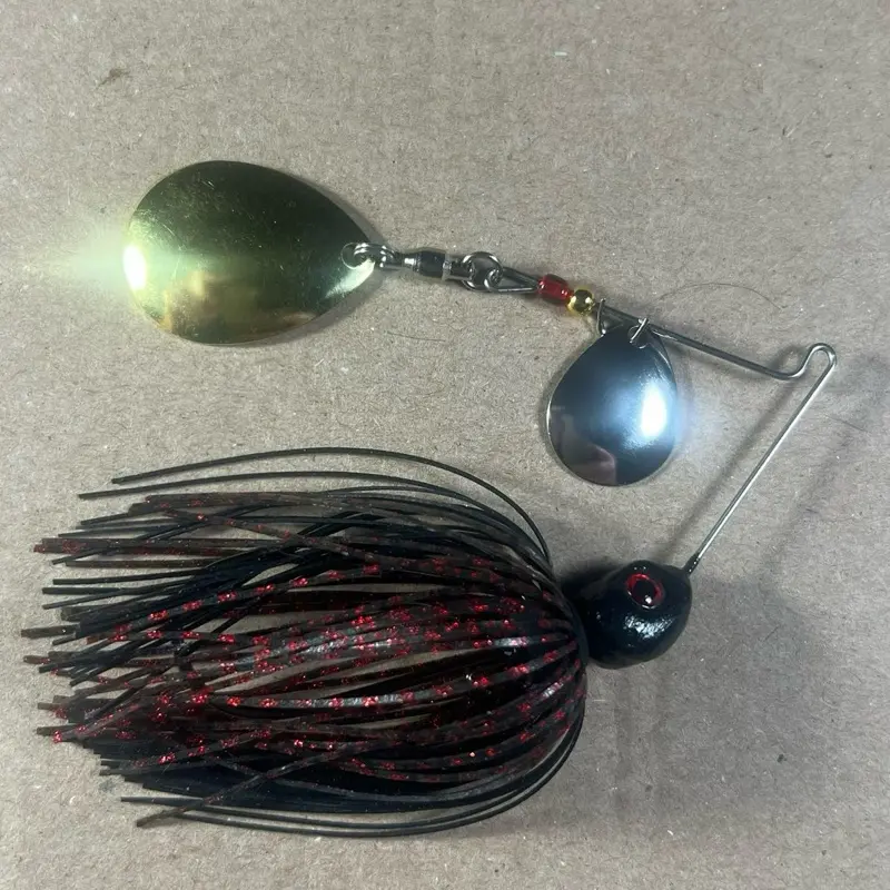 038 Custom Bingo Spinnerbait, 1/2oz Black Neon & Dark Melon Red Scales Double Colorado Nickel/Gold Blades with Brass Base, 80-Strand Tournament-Grade ProUmbrella Skirt, Hand-Crafted Premium Components in Texas, USA.