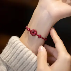 This red string bracelet with a health buckle is hand-woven and symbolizes peace and health. It's a cinnabar bracelet/ankle for men and women, representing their birth year