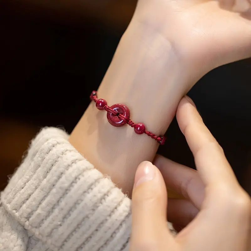 This red string bracelet with a health buckle is hand-woven and symbolizes peace and health. It's a cinnabar bracelet/ankle for men and women, representing their birth year