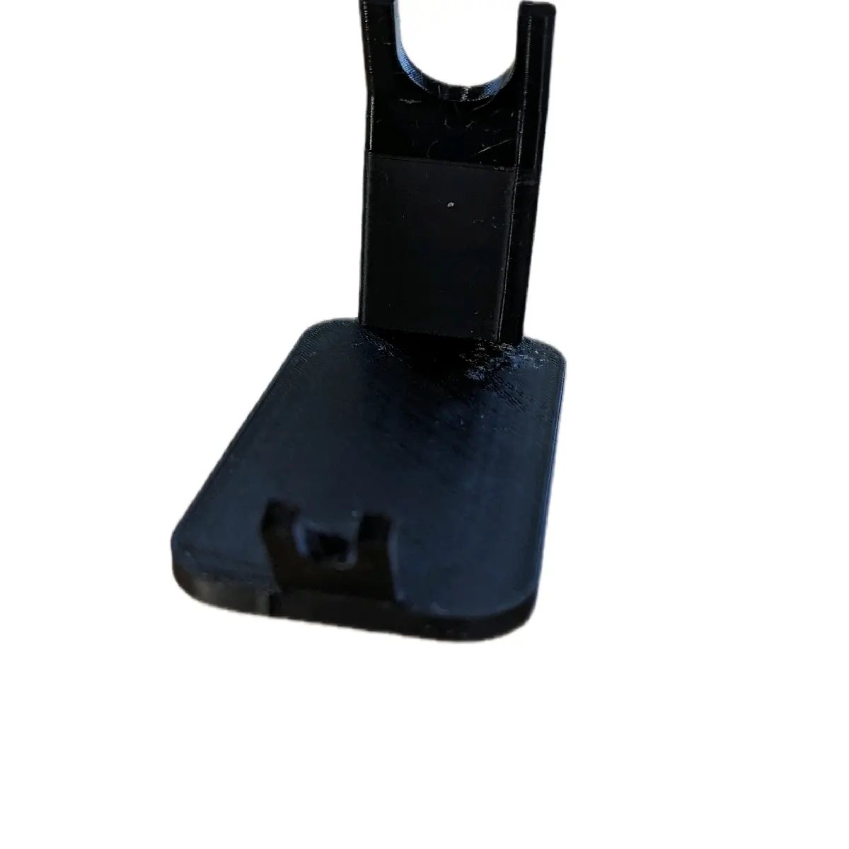 black plastic soldering iron stand