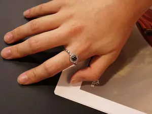 A retro and luxurious hexagonal hollowed-out ring with a fashionable and adjustable setting featuring cultivated olive green chalcedony.