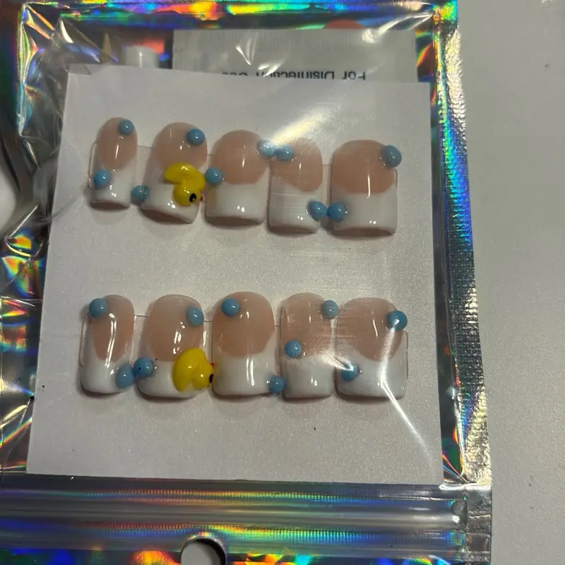 Bubble Bath Duck Nails with Blue Accents for Fun and Stylish Manicure