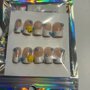 Bubble Bath Duck Nails with Blue Accents for Fun and Stylish Manicure