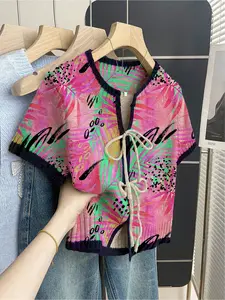 Women's khaki bohemian vacation short-sleeve knit top. Loose round neck, contrast leaf print, front tie and contrast piping. Comfortable for spring & summer casual wear.